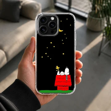 Snoopy lying on red doghouse under starry night on phone case — Lifestyle
