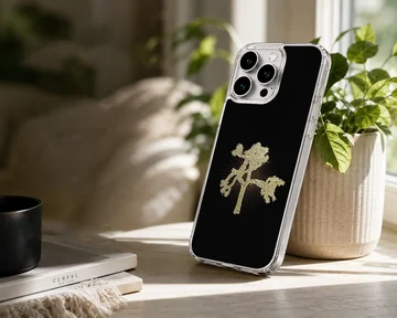 U2203 phone case with a minimalist gold tree design. — Lifestyle